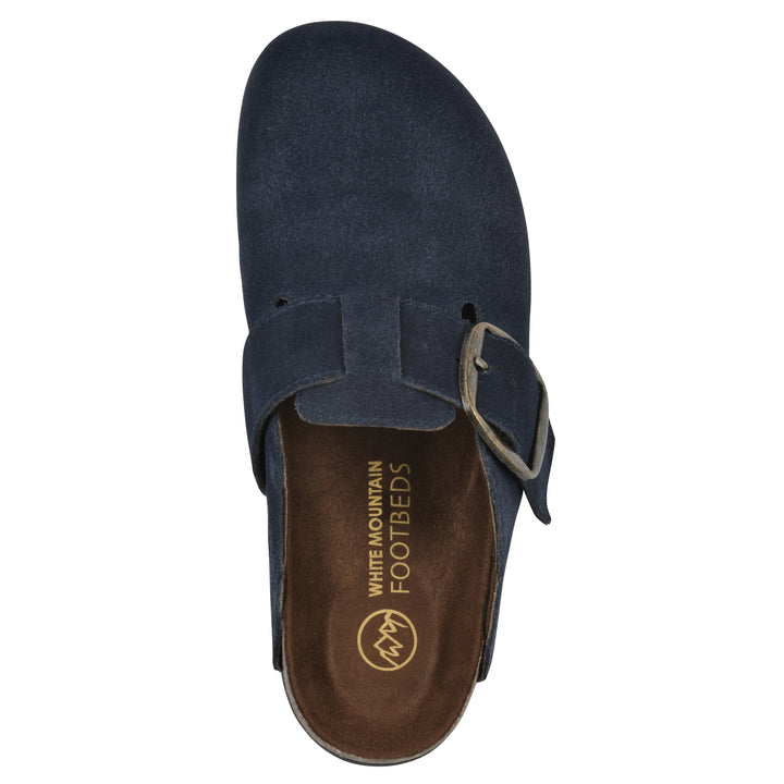 Top view of a navy suede backless clog with large adjustable buckle and a black sole