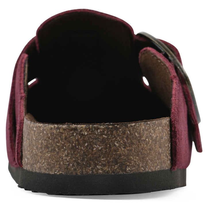 Rear view of a burgundy suede backless clog with large adjustable buckle and a black sole