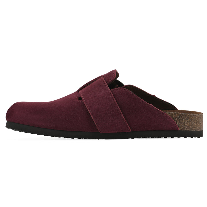 Side view of a burgundy suede backless clog with large adjustable buckle and a black sole
