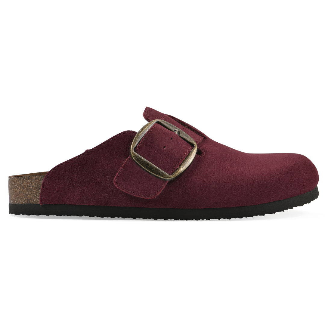 Side view of a burgundy suede backless clog with large adjustable buckle and a black sole