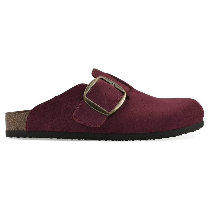 Side view of a burgundy suede backless clog with large adjustable buckle and a black sole