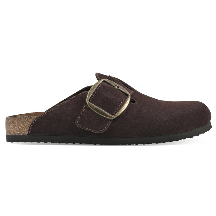 Side view of a brown suede backless clog with large adjustable buckle and a black sole