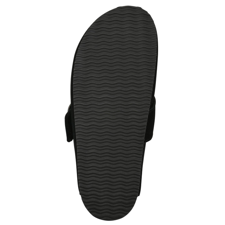 Sole view of a black suede backless clog with large adjustable buckle and a black sole
