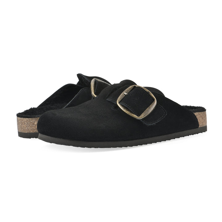 Angle view of a pair of black suede backless clogs with large adjustable buckle and a black sole