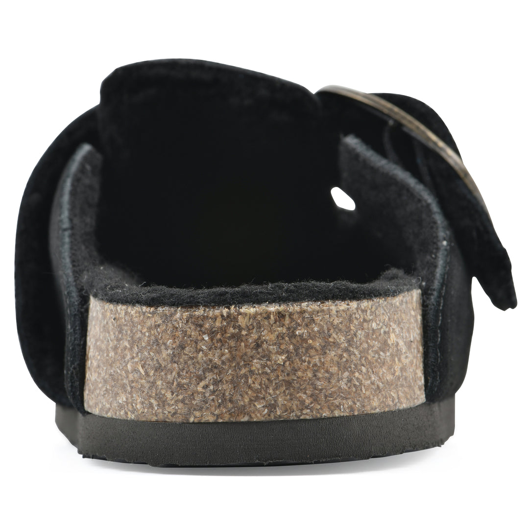 Rear view of a black suede backless clog with large adjustable buckle and a black sole