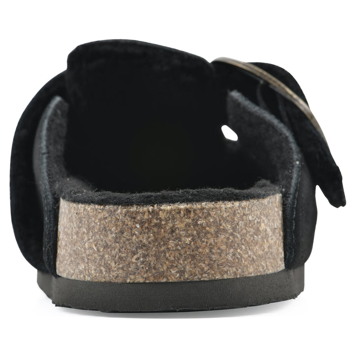 Rear view of a black suede backless clog with large adjustable buckle and a black sole