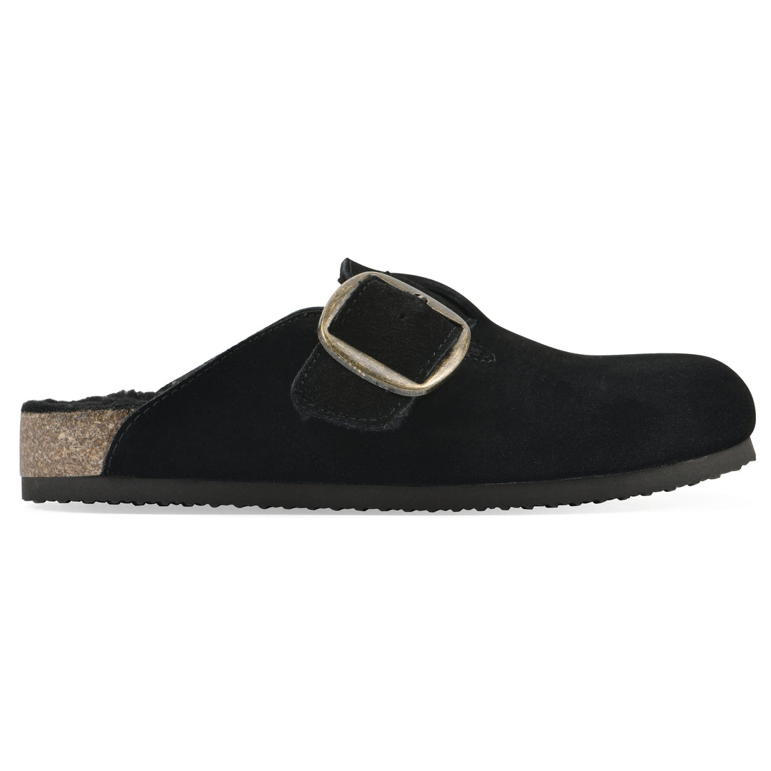 Side view of a black suede backless clog with large adjustable buckle and a black sole