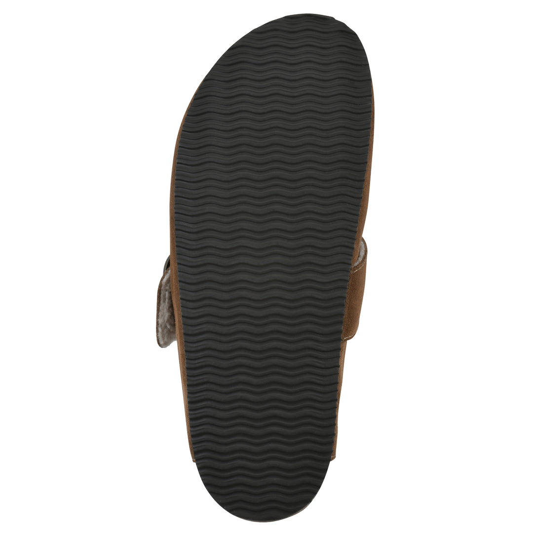 Sole view of a chestnut suede backless clog with cream, faux fur lining, a large adjustable buckle, and a black sole