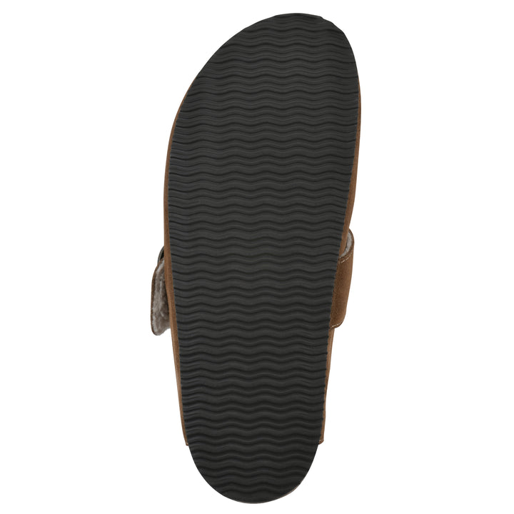 Sole view of a chestnut suede backless clog with cream, faux fur lining, a large adjustable buckle, and a black sole