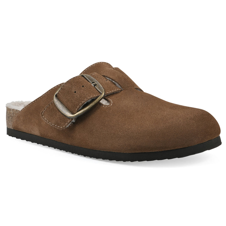 Angle view of a chestnut suede backless clog with cream, faux fur lining, a large adjustable buckle, and a black sole