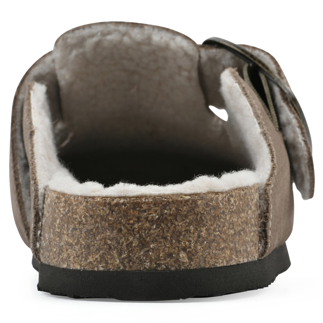 Rear view of a taupe suede backless clog with cream, faux fur lining, a large adjustable buckle, and a black sole