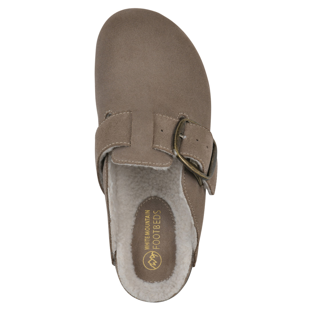 Top view of a taupe suede backless clog with cream, faux fur lining, a large adjustable buckle, and a black sole