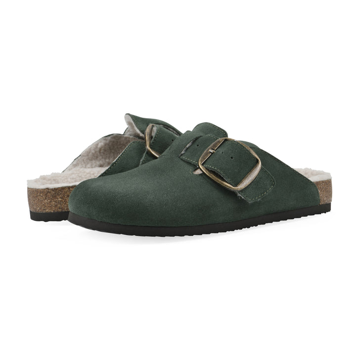 Angle view of a pair of hunter green suede backless clogs with cream, faux fur lining, a large adjustable buckle, and a black sole