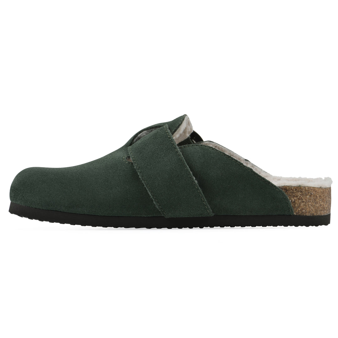 Side view of a hunter green suede backless clog with cream, faux fur lining, a large adjustable buckle, and a black sole