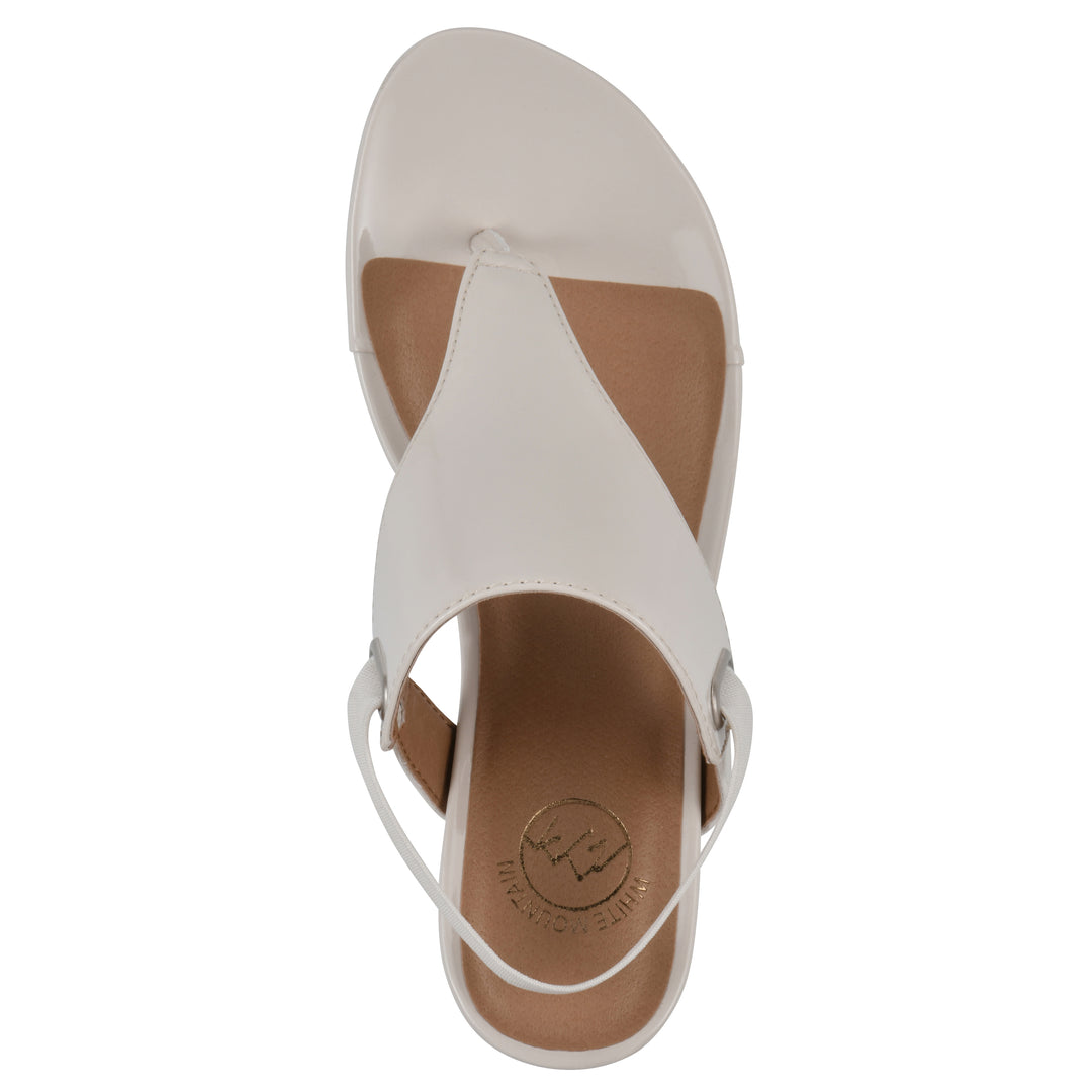 Top view of an eggshell patent thong wedge sandal with a wrapped heel, elastic ankle strap, and eggshell sole