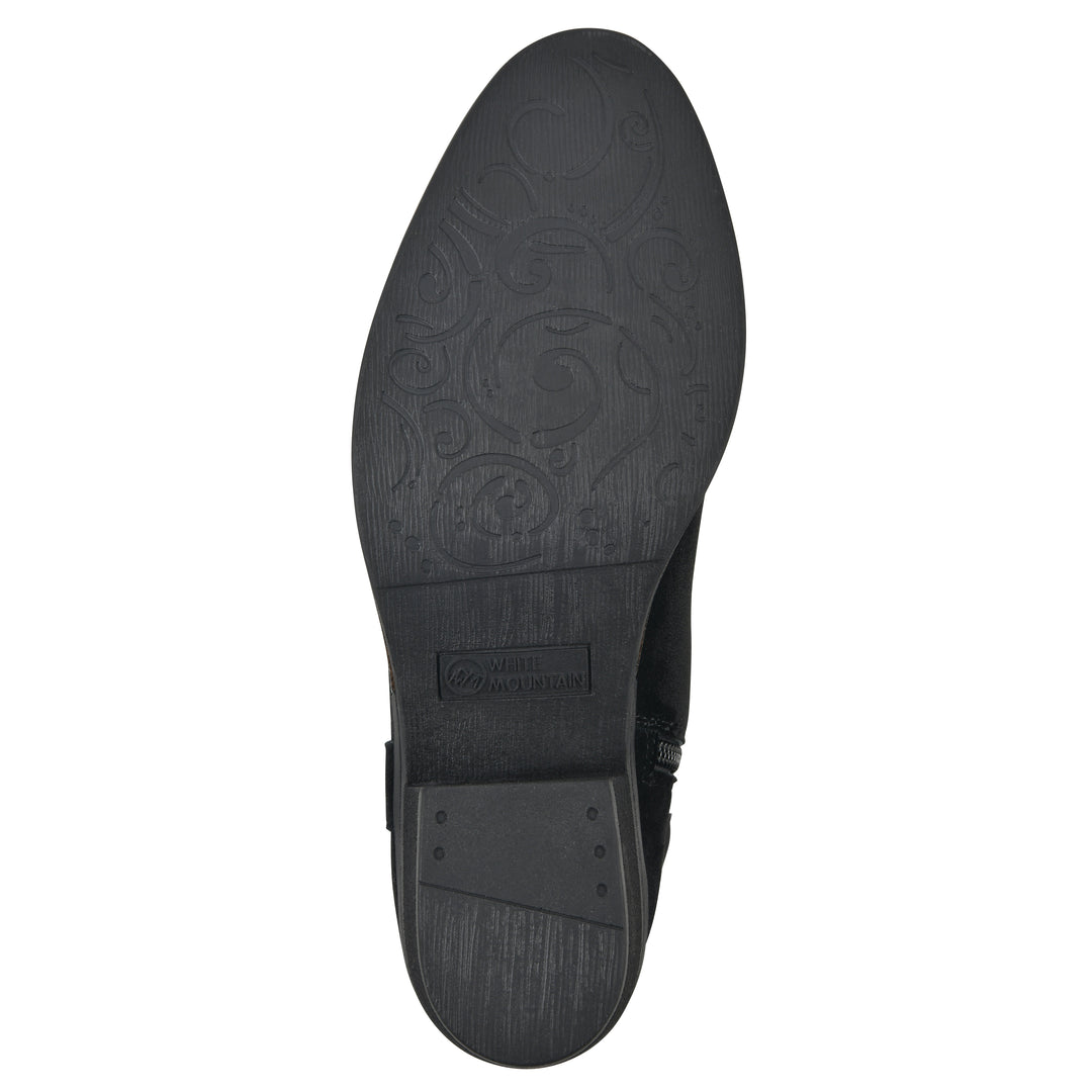 Sole view of a black suede tall boot with a low stacked, black heel, and tapered toe