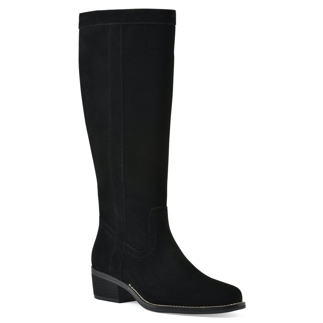 Angle view of a black suede tall boot with a low stacked, black heel, and tapered toe