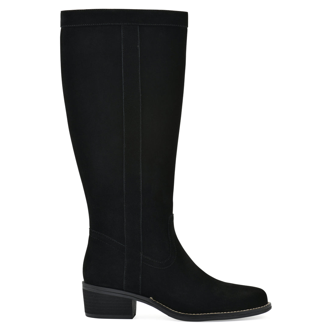 Side view of a black suede tall boot with a low stacked, black heel, and tapered toe