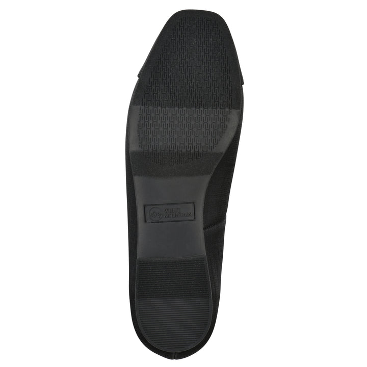 Sole view of a black shimmer fabric flat with small, centered black bow and a black sole