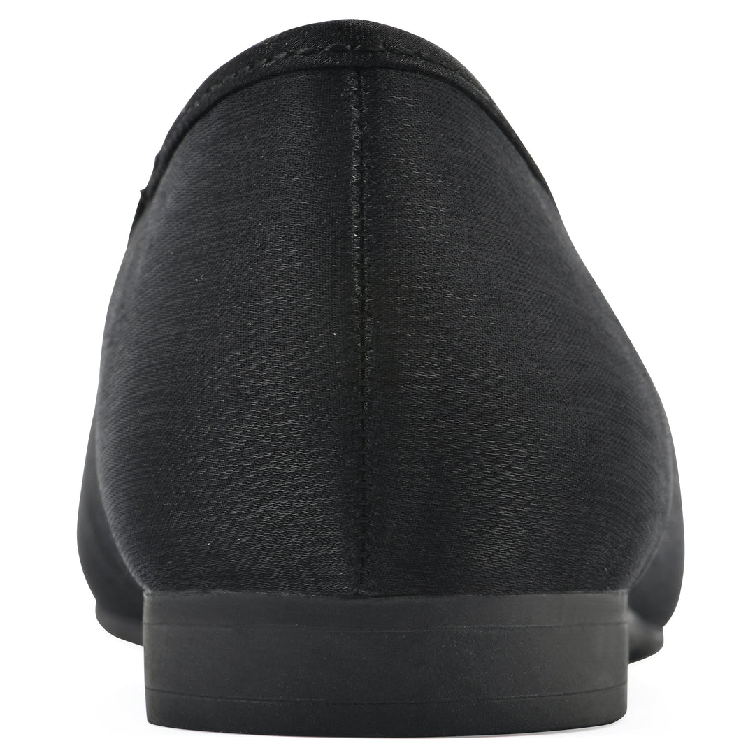 Rear view of a black shimmer fabric flat with small, centered black bow and a black sole