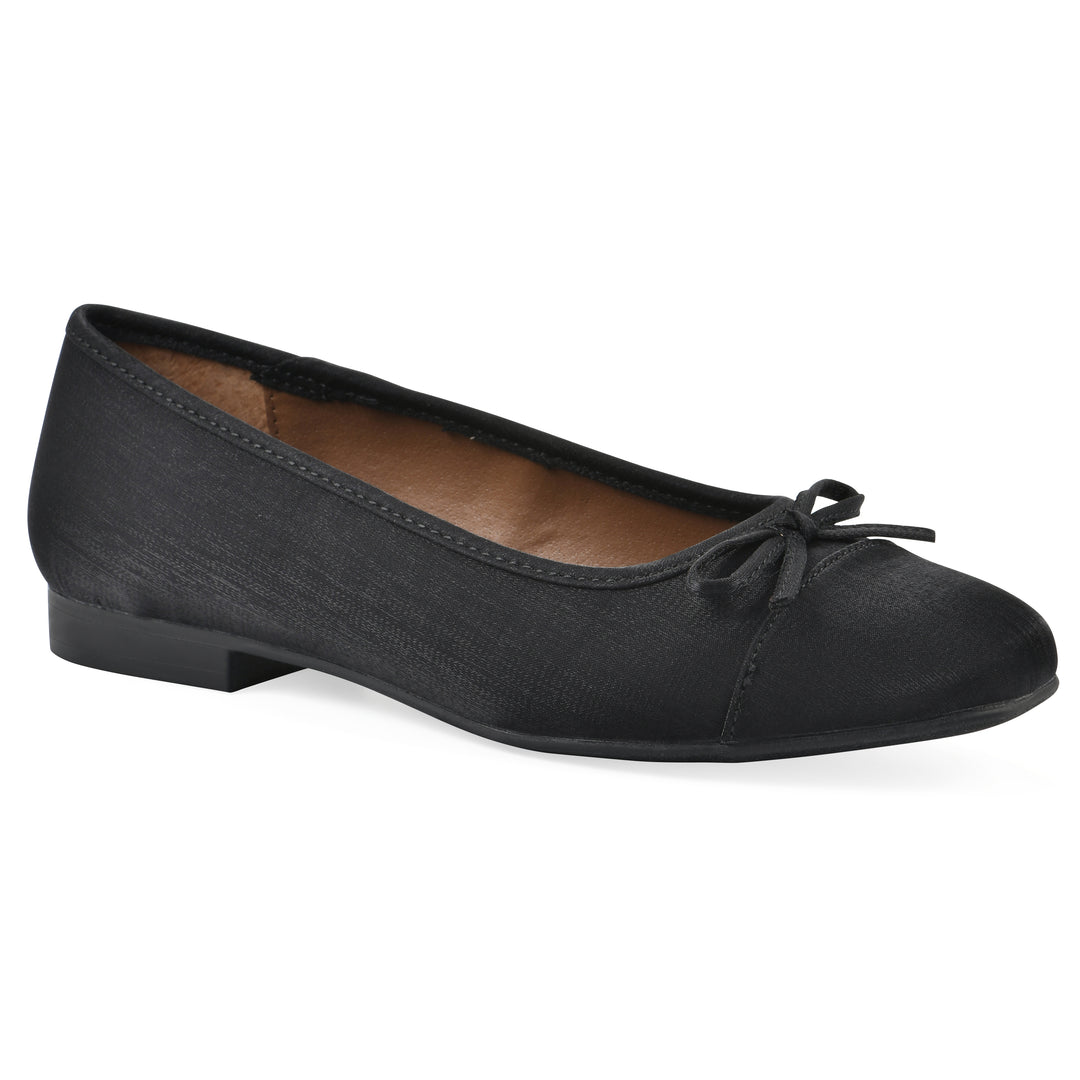 Angle view of a black shimmer fabric flat with small, centered black bow and a black sole