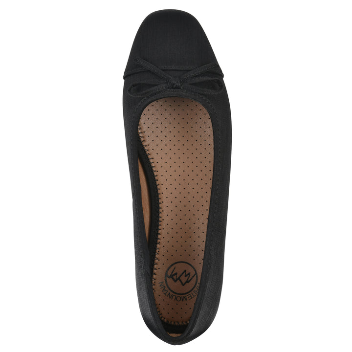 Top view of a black shimmer fabric flat with small, centered black bow and a black sole