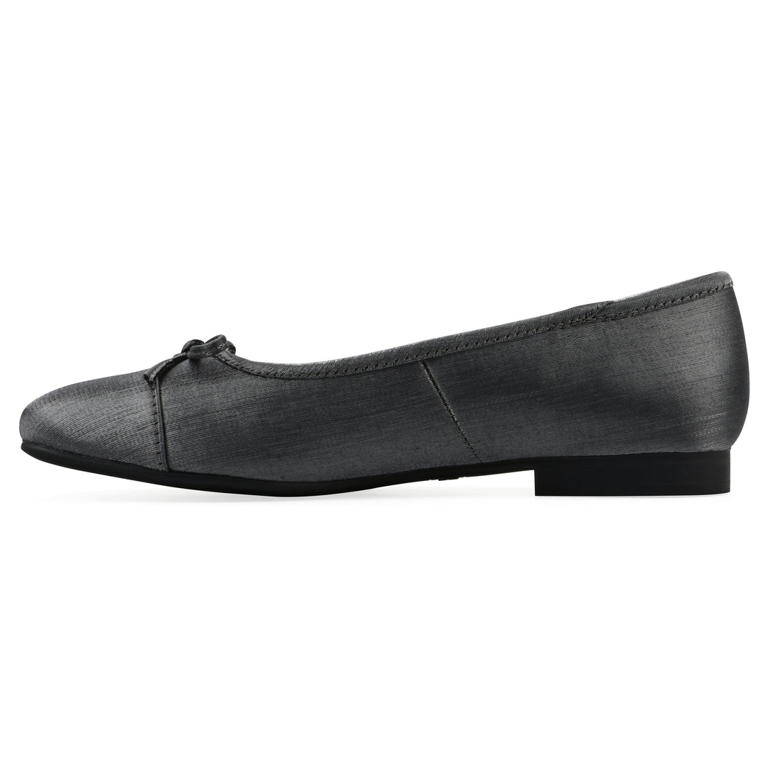 Side view of a gunmetal shimmer fabric flat with small, centered black bow and a black sole