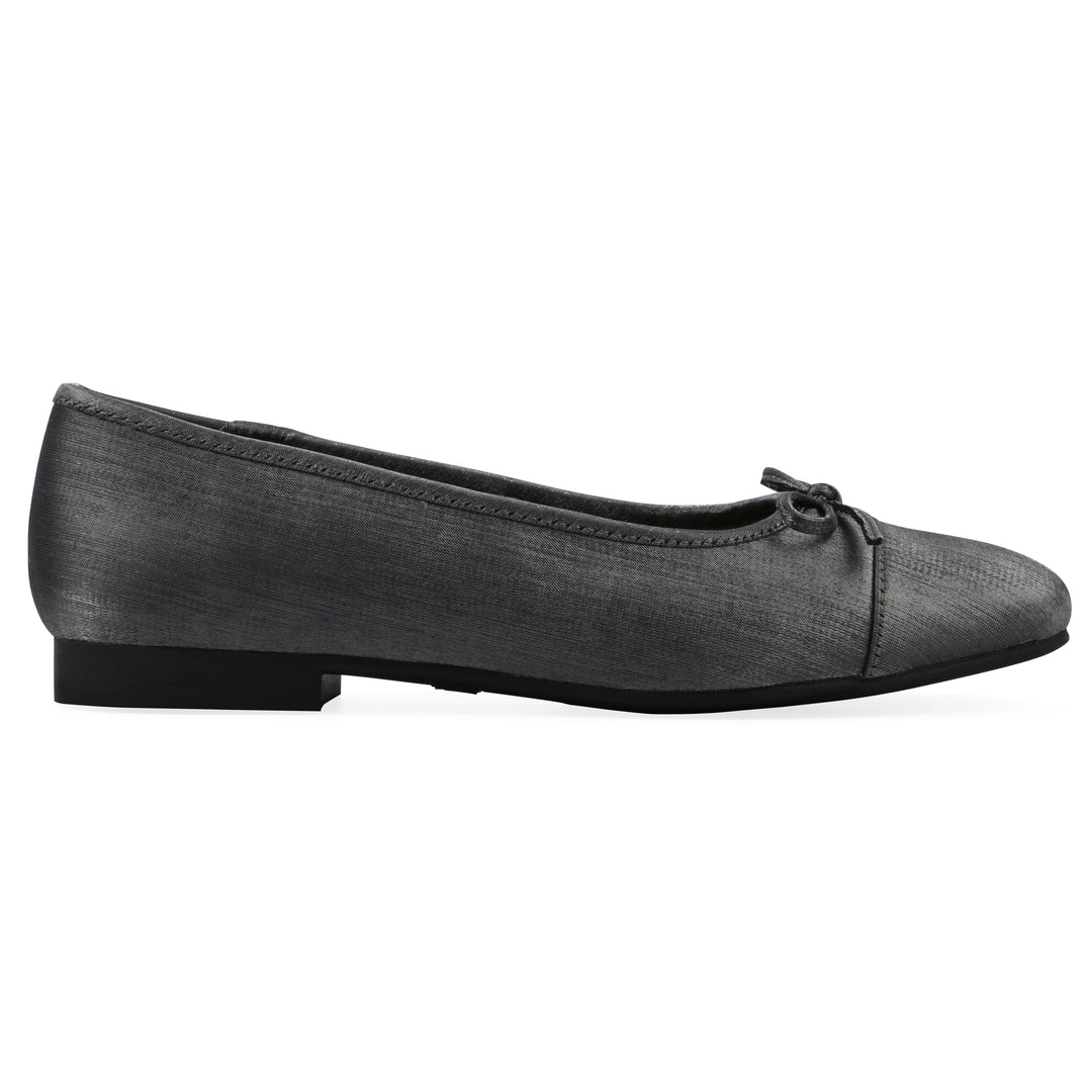Side view of a gunmetal shimmer fabric flat with small, centered black bow and a black sole