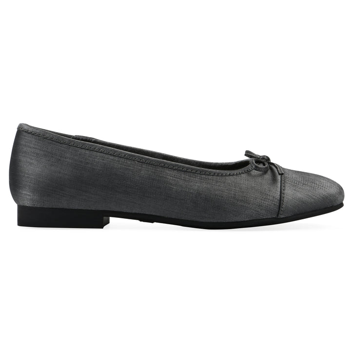 Side view of a gunmetal shimmer fabric flat with small, centered black bow and a black sole