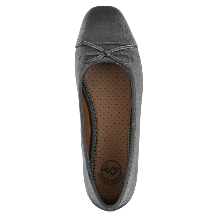 Top view of a gunmetal shimmer fabric flat with small, centered black bow and a black sole
