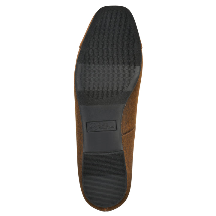 Sole view of a bronze shimmer fabric flat with small, centered black bow and a black sole