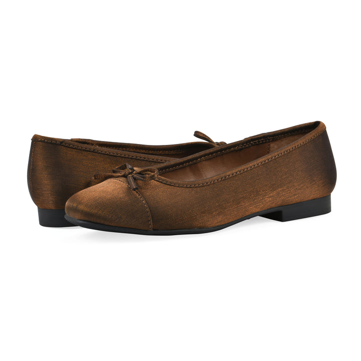Angle view of a pair of bronze shimmer fabric flats with small, centered black bow and a black sole