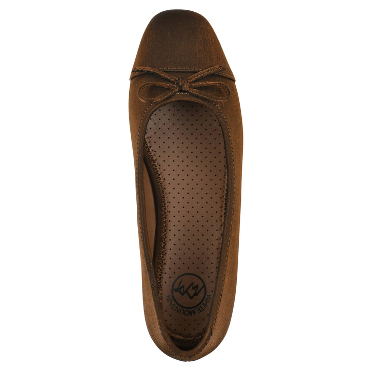 Top view of a bronze shimmer fabric flat with small, centered black bow and a black sole