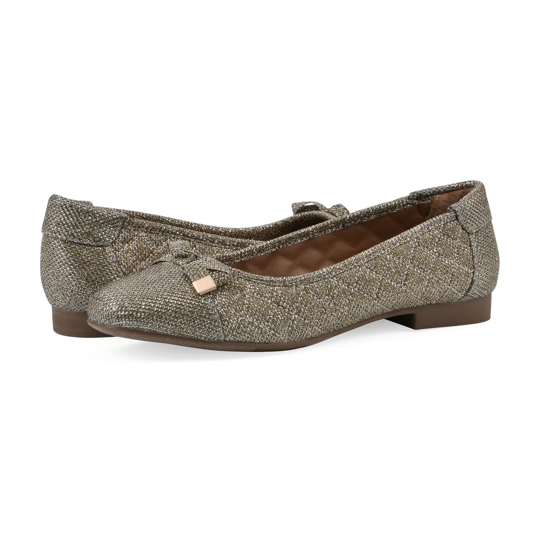 Angle view of a pair of gold glitter quilted pattern flats with small, centered bow and a brown sole
