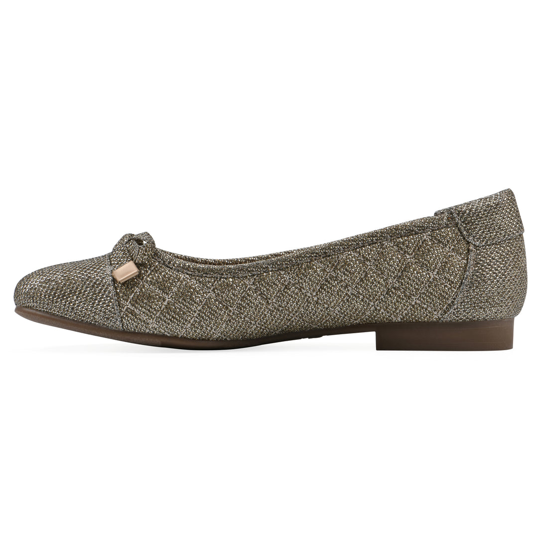 Side view of a gold glitter quilted pattern flat with small, centered bow and a brown sole
