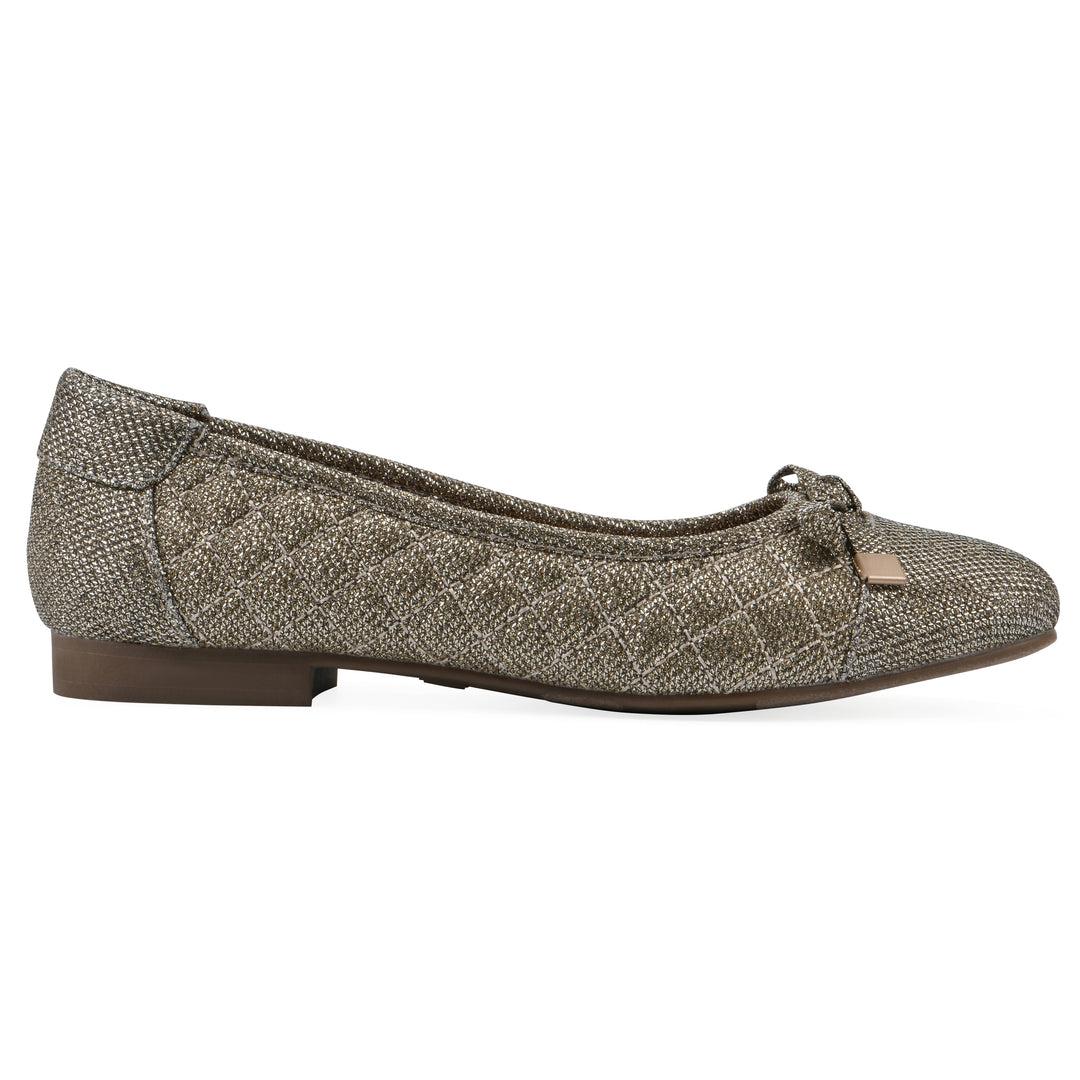Side view of a gold glitter quilted pattern flat with small, centered bow and a brown sole