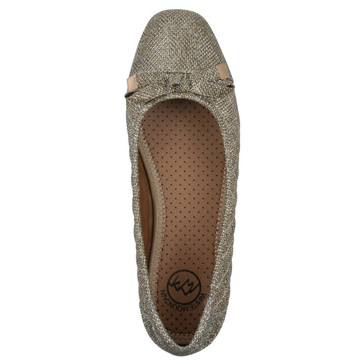 Top view of a gold glitter quilted pattern flat with small, centered bow and a brown sole