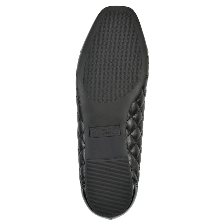 Sole view of a black quilted pattern flat with smooth patent toe cap, small, centered bow and a black sole