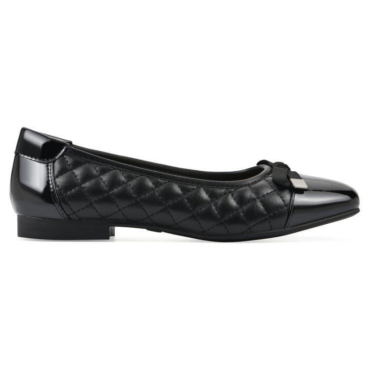Side view of a black quilted pattern flat with smooth patent toe cap, small, centered bow and a black sole