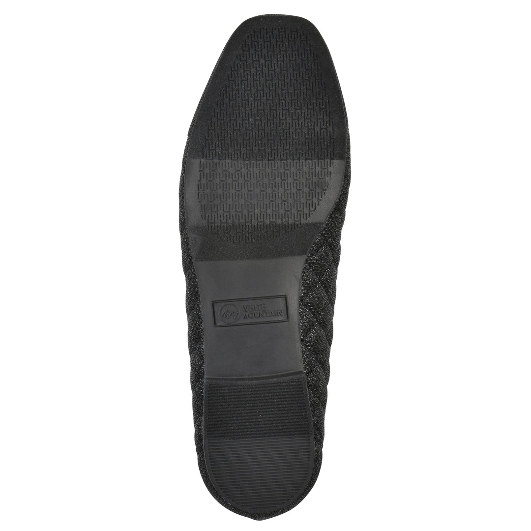 Sole view of a black glitter quilted pattern flat with small, centered bow and a black sole