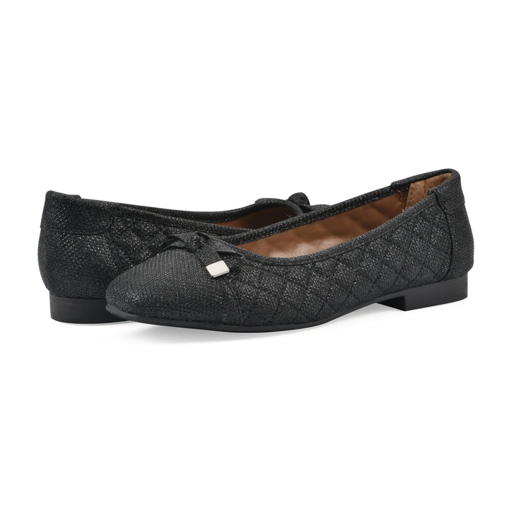 Angle view of a pair of black glitter quilted pattern flat with small, centered bow and a black sole
