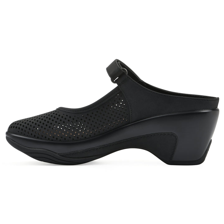 Side view of a black colored clog with a closed toe and adjustable strap, featuring a perforated diamond design and a low heel.