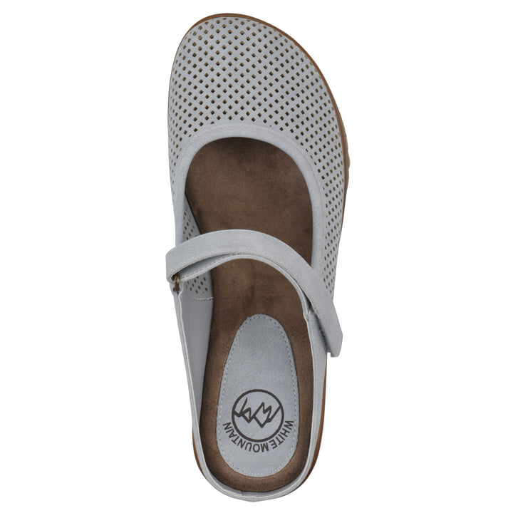 Top view of a pastel blue colored clog with a closed toe and adjustable strap, featuring a perforated diamond design and a low heel.