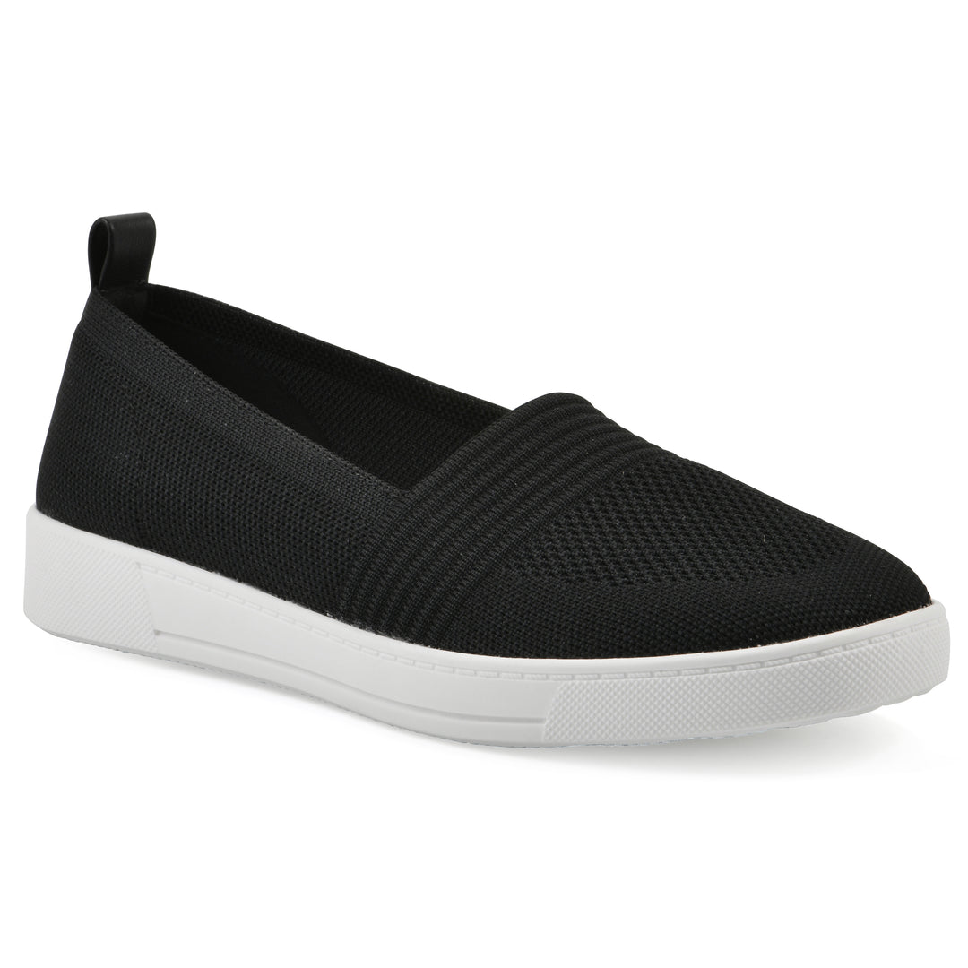 Angle view of a black slip-on sneaker with white sole, and perforated mesh fabric