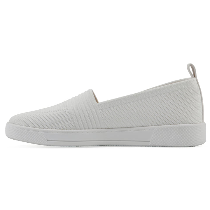 Side view of a white slip-on sneaker with white sole, and perforated mesh fabric