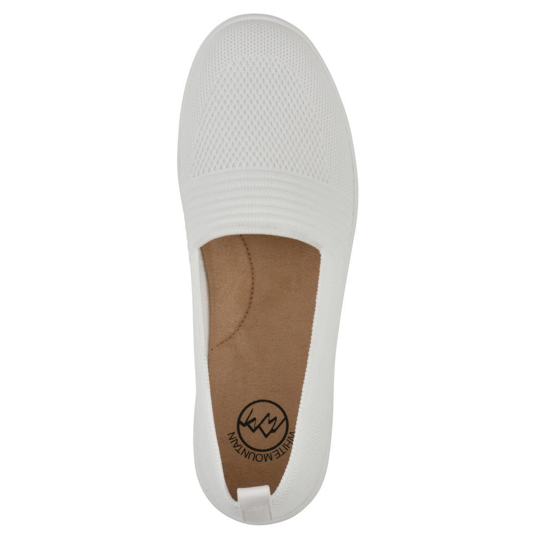 Top view of a white slip-on sneaker with white sole, and perforated mesh fabric