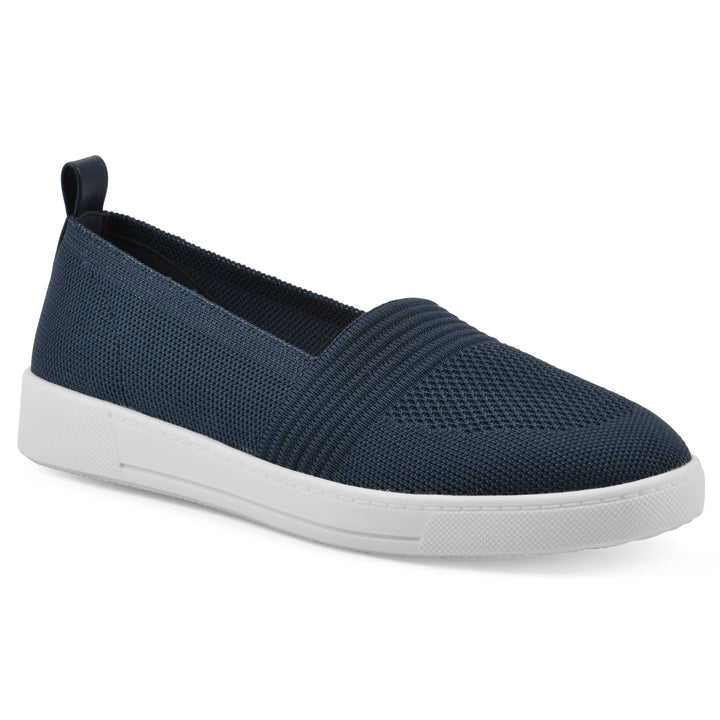 Angle view of a navy slip-on sneaker with white sole, and perforated mesh fabric