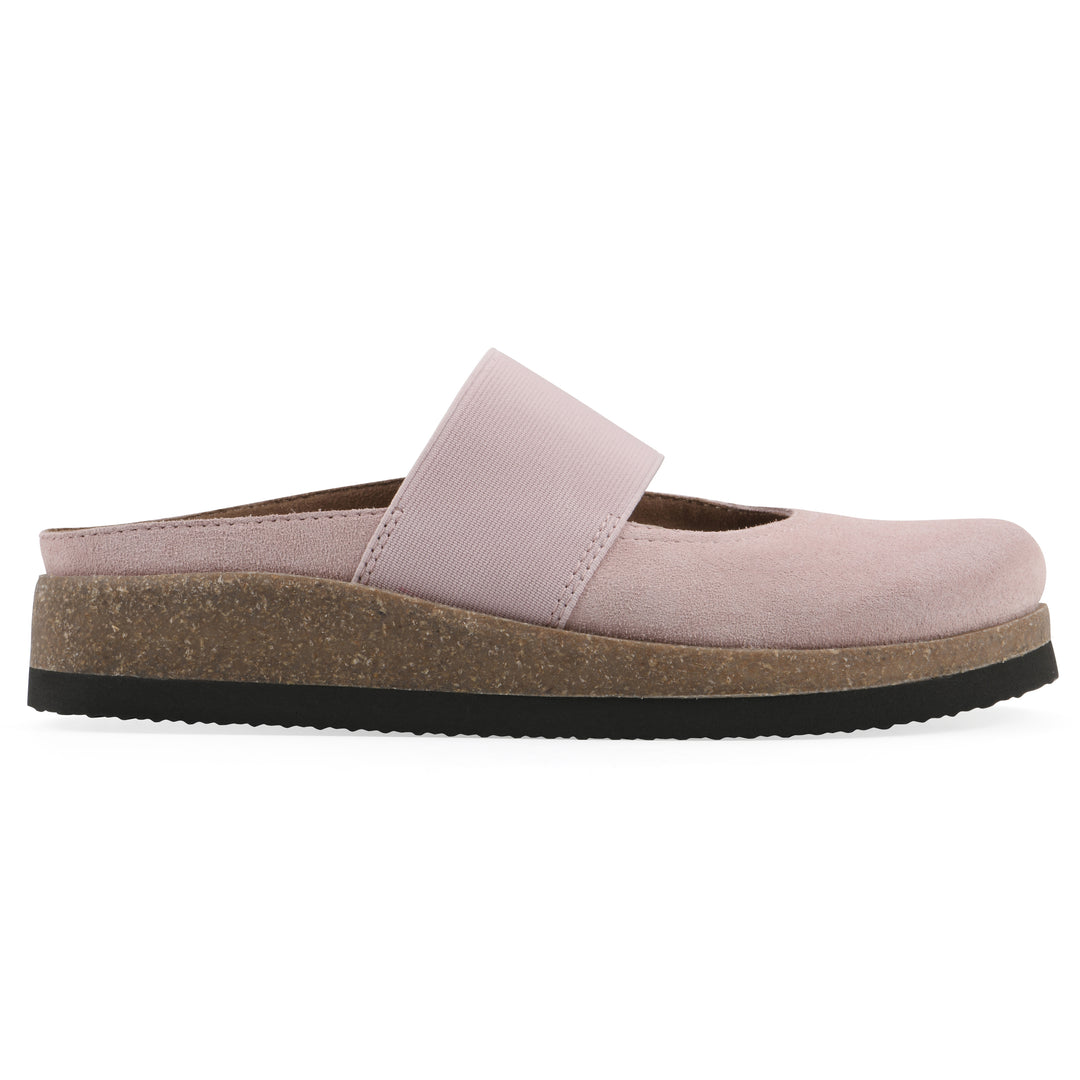 Side view of a light pink suede backless clog with Mary Jane style center strap and a brown sole with black bottom