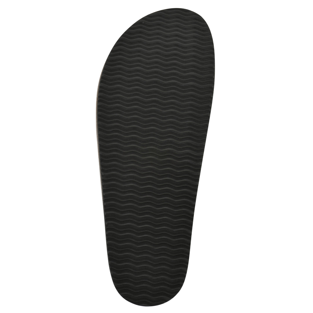 Sole view of a denim backless clog with Mary Jane style center strap and a brown sole with black bottom