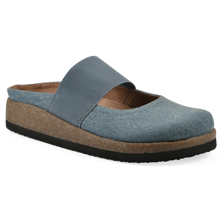Angle view of a denim backless clog with Mary Jane style center strap and a brown sole with black bottom